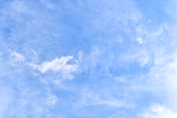 beautiful blue sky and white fluffy group of clouds with sunrise in the morning, natural background