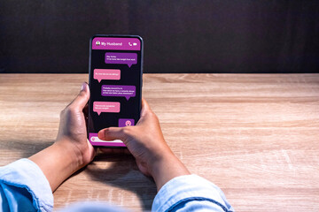 Woman typing message on a smartphone. Text message or online chat app with smartphone. Chatting,...