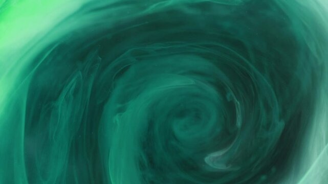 Smoke vortex. Blur mist swirl. Storm twirl. Defocused cyan green blue color paint water blend spiral rotating motion on dark abstract art background.