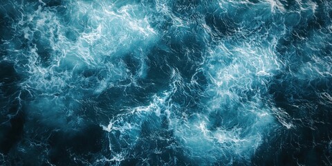 Fototapeta premium Top view of dark blue ocean wave surface, swirling, abstract.
