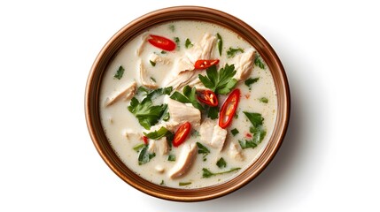 Traditional thai tom kha gai soup with chicken, coconut milk, and fresh herbs