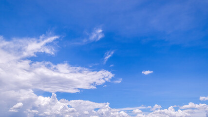 Fototapeta premium clear blue sky background,clouds with background, Blue sky background with tiny clouds. White fluffy clouds in the blue sky. 