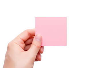 A hand holding a pink sticky note ready to stick it on a surface isolated on white background