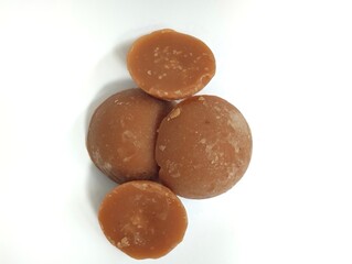 palm sugar or Javanese sugar or kawung sugar on a white background. sugar made from palm tree sap.