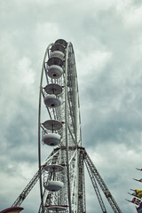 Ferris Wheel Against Dramatic Cloudy Sky in Blackpool, UK
