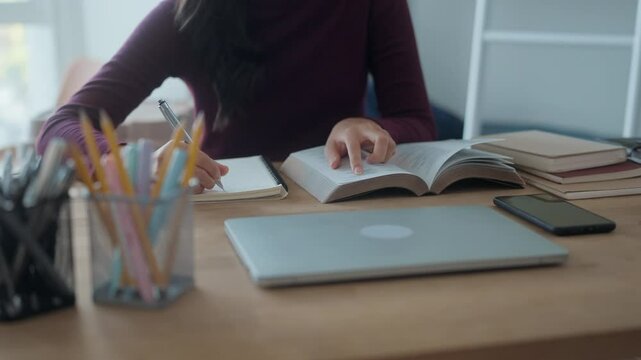 University students are reading and taking notes in dorm room