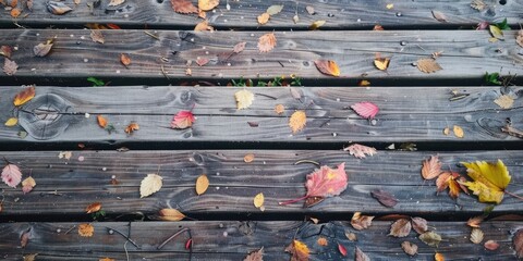 Naklejka premium Attractive wood textures and leaf remnants on the weathered wooden bridge surface