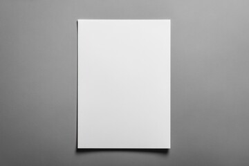 A white piece of paper is hanging on a wall