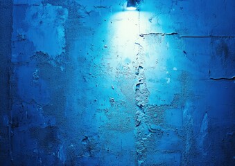 A blue wall with a light shining on it