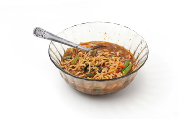 Mie Tek Tek or mie dok dok Noodles with boiled noodles filled with eggs, vegetables, chilies. Boiled noodle soup with spices, thick and savory sauce. isolated on white background