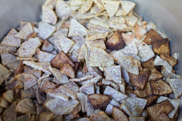 Lots of taro slices in a metal pan.