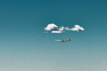 A glider flies in the sky