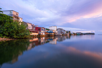 People's houses along the Bang Nara River Narathiwat Province, Thailand.