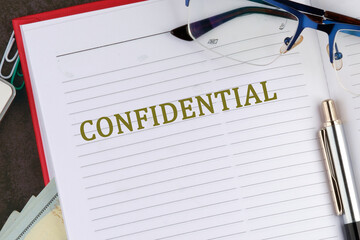 CONFIDENTIAL word alphabet letters there is a memo for analysis in the business notebook