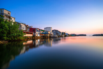 Fototapeta premium People's houses along the Bang Nara River Narathiwat Province, Thailand.