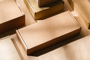 Multiple cardboard boxes arranged on a surface for packaging and shipping in a warehouse setting