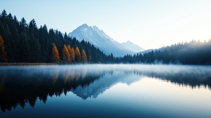 Fototapeta premium Serene mountain landscape with misty lake and autumn trees, capturing tranquil nature beauty and peaceful reflections at dawn.