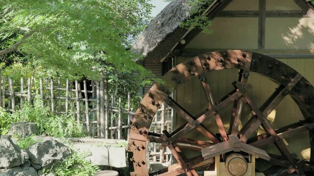 Tokyo Scene : Traditional Waterwheel Spins on a Thatched Hut  |  Tokyo, Japan