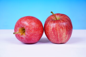 Bright red apple with a glossy surface. Food concept