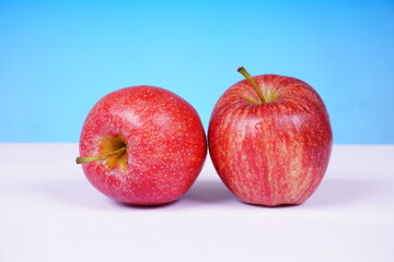 Bright red apple with a glossy surface. Food concept