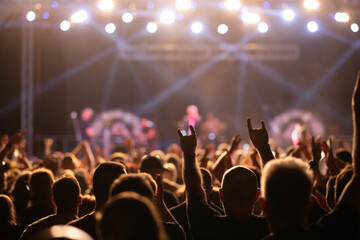 Naklejka premium Crowd at concert and colorful stage lights.