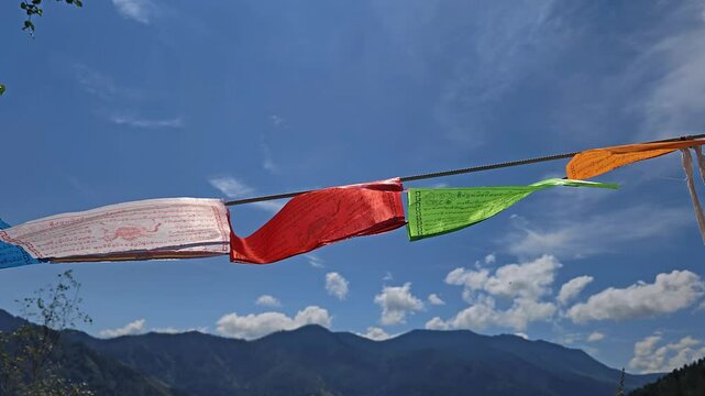 Slow motion video of Religious tibetan buddhist prayer flags in Altai mountains.