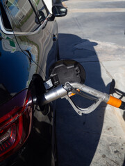 person filling up lpg at a gas station