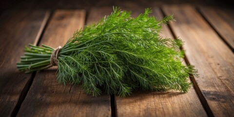 Top view of a cluster of fresh dill on a rustic wooden surface providing ample copy space for a picture.