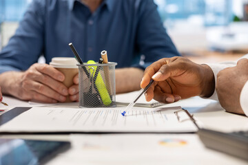 Senior people reading retirement plan contract terms with broker, exploring their options to secure...
