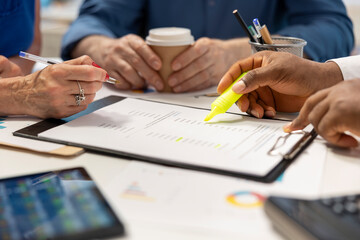 Financial planner expert highlighting contract terms for a detailed retirement plan, counseling about income and life savings to secure the future. Adviser helps old people. Close up.