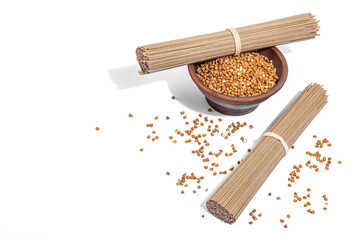 Japanese buckwheat soba noodles. Classic ingredient for preparing traditional dishes. Ceramic bowl