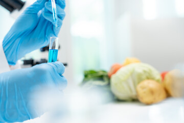 Scientist check chemical food residues in laboratory. Control experts inspect quality of fruits,...