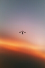 airplane landing at sunset