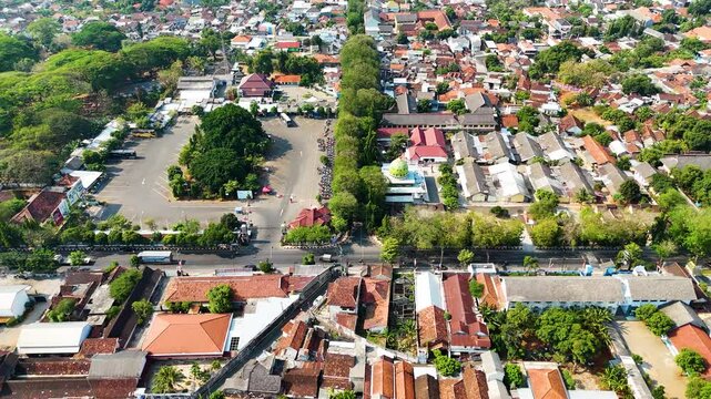 Aerial shot of a residential area, cityscape of Tuban Regency, East Java, Indonesia. Showing the Java Sea in the background.