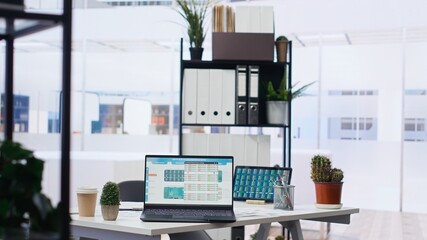 Stock market shares going up and down on laptop in empty financial department office, price volatility concept. Forex trading economic analytics figures on notebook screen in workplace