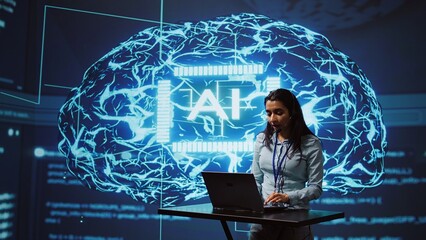 Technician in high tech workspace managing call center tasks, speaking into headset while doing...