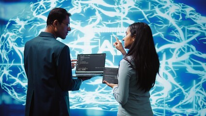 Programmers using devices and AI neural networks modeled after human brain to solve complex...