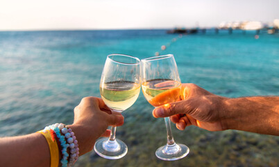 Glasses of wine on the seashore. Selective focus.