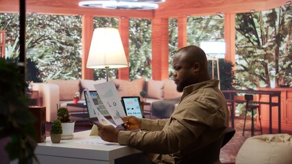 Business owner reviewing key performance indicators within the enterprise activity, remote work at...