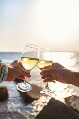 Glasses of wine on the seashore. Selective focus.