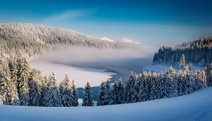 Winter fog rolling over a snowy lake