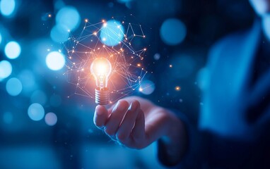 A glowing light bulb held by a hand, symbolizing ideas and innovation in a digital world filled with possibilities.