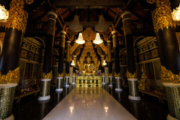 Buddha statue in the temple and sculpture patterns at Wat Phra That Doi Phra Chan Mae Tha, Lampang...