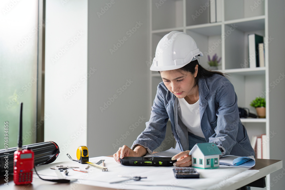 Aufkleber civil engineer evaluating construction plans using a level for accurate project execution