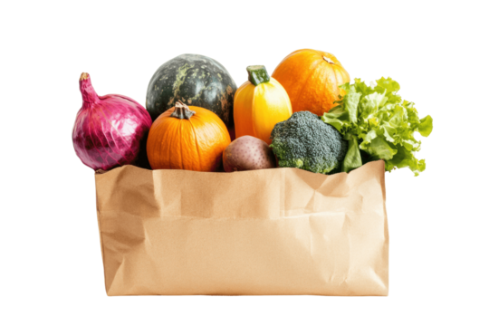 A paper bag overflowing with fresh produce, including pumpkins, a red onion, and a head of broccoli.