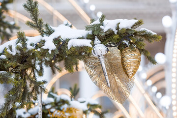 Beautiful festive decorations on the Christmas tree. Close-up. Beautiful Christmas background. The concept of decorations and decor for the new year. New Year's Card 2025