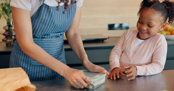 Mother, daughter and packing lunch with container for morning, healthy snack or meal to school at home. Mom helping child, young kid or little girl getting ready for kindergarden with food at house