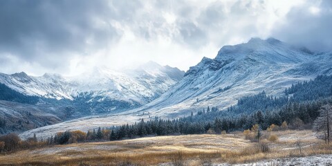 Fototapeta premium mountain range touched by early snow