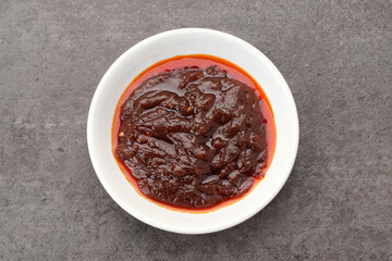 Gochujang, fermented spicy sauce made by mixing coarse rice with powdered soybean paste and red chili
