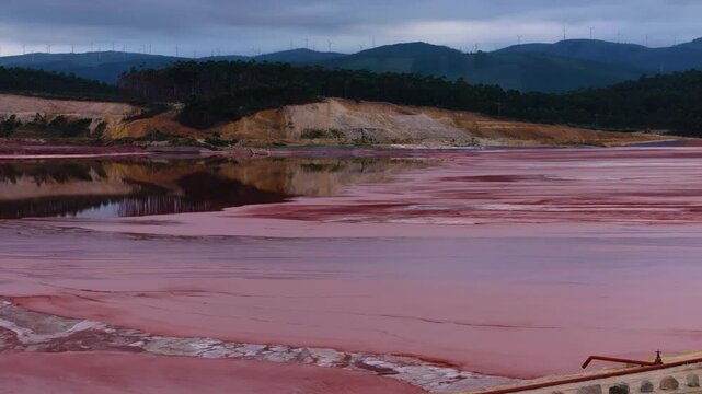 Red Sludge Pond Of Alcoa Polluted With Toxic Alkaline Waste In Lugo, Spain. drone shot